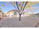 Mature trees and grassy yard with gravel accents at 10201 Los Padres Pl, Las Vegas, NV 89134