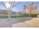 Large backyard with gravel areas and lush greenery at 10201 Los Padres Pl, Las Vegas, NV 89134