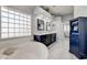 Spa-like bathroom with a large soaking tub and double vanity at 10201 Los Padres Pl, Las Vegas, NV 89134