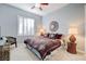 Serene bedroom with a king-size bed and decorative accents at 10201 Los Padres Pl, Las Vegas, NV 89134