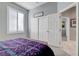 Bedroom with window shutters, closet, and view of hallway at 10201 Los Padres Pl, Las Vegas, NV 89134