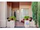 Front entrance with tiled flooring, wicker furniture, and potted plants at 10201 Los Padres Pl, Las Vegas, NV 89134