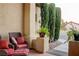 Front entrance with tiled flooring, wicker furniture, and potted plants at 10201 Los Padres Pl, Las Vegas, NV 89134