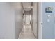 Bright hallway with light gray walls and wood-look floors at 10201 Los Padres Pl, Las Vegas, NV 89134