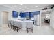 Modern kitchen with blue cabinets, stainless steel appliances, and an island at 10201 Los Padres Pl, Las Vegas, NV 89134