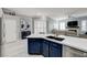 Modern kitchen island with a double sink and white countertop at 10201 Los Padres Pl, Las Vegas, NV 89134