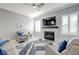 Bright living room featuring a fireplace and stylish decor at 10201 Los Padres Pl, Las Vegas, NV 89134