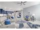 Relaxing living room with gray sectional and blue accents at 10201 Los Padres Pl, Las Vegas, NV 89134