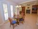 Small breakfast nook with round table and chairs, near sliding doors at 10718 Del Rudini St, Las Vegas, NV 89141