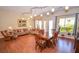 Dining area with hardwood floors, light walls, and a view to the living room at 10718 Del Rudini St, Las Vegas, NV 89141