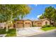 Single-story house with two-car garage and landscaped yard at 10718 Del Rudini St, Las Vegas, NV 89141