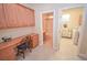 Convenient laundry room with washer, dryer, and built-in cabinets at 10718 Del Rudini St, Las Vegas, NV 89141