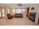 Bright living room with a fireplace and comfortable seating at 10718 Del Rudini St, Las Vegas, NV 89141