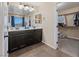 Bathroom with double vanity sinks, and a view into a large walk-in closet at 11290 Hazel Rock St, Las Vegas, NV 89179