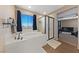 Bright bathroom featuring a soaking tub, a separate glass-enclosed shower, and a large window at 11290 Hazel Rock St, Las Vegas, NV 89179