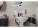 Bedroom with ceiling fan, neutral walls, and carpeted floor at 11290 Hazel Rock St, Las Vegas, NV 89179