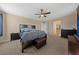 Bright primary bedroom with a large bed, side tables, and a view of the closet at 11290 Hazel Rock St, Las Vegas, NV 89179