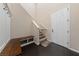 Light and airy entryway features hardwood floors, coat hooks and a staircase with a safety gate at 11290 Hazel Rock St, Las Vegas, NV 89179