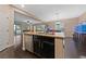 Open concept kitchen featuring a kitchen island with stainless steel dishwasher at 11290 Hazel Rock St, Las Vegas, NV 89179