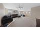 Open living room featuring a comfortable sectional sofa and lots of natural light at 11290 Hazel Rock St, Las Vegas, NV 89179