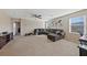 Spacious living room featuring carpeted floor, neutral walls, and ceiling fan at 11290 Hazel Rock St, Las Vegas, NV 89179