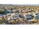 Aerial view of a house and neighborhood; highlighting the home's backyard and surroundings at 12 Oro Valley Dr, Henderson, NV 89052