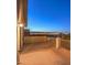 Enjoy spectacular city views from this large balcony with white metal railing, perfect for evening relaxation at 12 Oro Valley Dr, Henderson, NV 89052