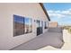 A covered balcony area is accessed from a sliding glass door and features a light stucco exterior at 12 Oro Valley Dr, Henderson, NV 89052