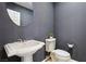 Well-appointed bathroom with pedestal sink and toilet at 12 Oro Valley Dr, Henderson, NV 89052