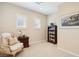 Bedroom with shuttered windows, a bookshelf, chair and neutral walls at 12 Oro Valley Dr, Henderson, NV 89052