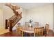 Round dining table with six chairs near a wooden staircase at 12 Oro Valley Dr, Henderson, NV 89052