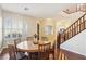 Round dining table with six chairs in a bright dining area at 12 Oro Valley Dr, Henderson, NV 89052