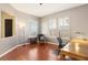 Bright home office features wood floors, built-in desk, and large windows with plantation shutters at 12 Oro Valley Dr, Henderson, NV 89052