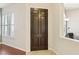 Dark brown, six-panel interior door with simple design at 12 Oro Valley Dr, Henderson, NV 89052