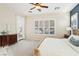 Main bedroom with backyard access, dresser and large windows with plantation shutters at 12 Oro Valley Dr, Henderson, NV 89052