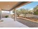 Spacious covered patio with concrete flooring, support beams, and backyard views at 12 Oro Valley Dr, Henderson, NV 89052