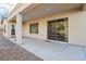 Covered patio with concrete flooring, a sliding glass door, and a view of the backyard at 12 Oro Valley Dr, Henderson, NV 89052