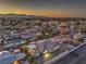 Aerial view of home, highlighting its roof, backyard with patio, and the neighborhood at 1202 S Rancho Dr, Las Vegas, NV 89102