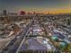 High angle aerial view of the home and neighborhood featuring city views at sunset at 1202 S Rancho Dr, Las Vegas, NV 89102