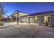 Covered patio with a seating area and landscaping, adjacent to the house at 1202 S Rancho Dr, Las Vegas, NV 89102