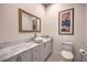 Elegant bathroom with white cabinets and a marble countertop at 1202 S Rancho Dr, Las Vegas, NV 89102