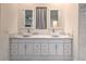 Bathroom vanity with dual vessel sinks, modern fixtures, and bright lighting at 1202 S Rancho Dr, Las Vegas, NV 89102