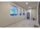 Spacious foyer boasts tile floors, arched windows and an iron-wrought front door at 1202 S Rancho Dr, Las Vegas, NV 89102