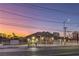 House exterior view at dusk, showcasing the front yard and curb appeal at 1202 S Rancho Dr, Las Vegas, NV 89102