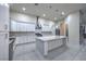 Spacious white kitchen featuring a large island with marble countertops and modern appliances at 1202 S Rancho Dr, Las Vegas, NV 89102