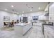 Bright kitchen with marble countertops, stainless steel appliances, a large island and dining area at 1202 S Rancho Dr, Las Vegas, NV 89102