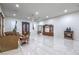 Open living room with tiled floors, ceiling fan, and ornate furniture at 1202 S Rancho Dr, Las Vegas, NV 89102