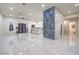 Open concept living area with kitchen and a marble accent wall at 1202 S Rancho Dr, Las Vegas, NV 89102