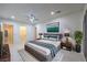 Modern main bedroom featuring neutral colors, a ceiling fan, and access to an en-suite bathroom at 1202 S Rancho Dr, Las Vegas, NV 89102