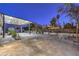 Wide angle view of a large patio, showcasing multiple seating areas and desert landscaping at 1202 S Rancho Dr, Las Vegas, NV 89102